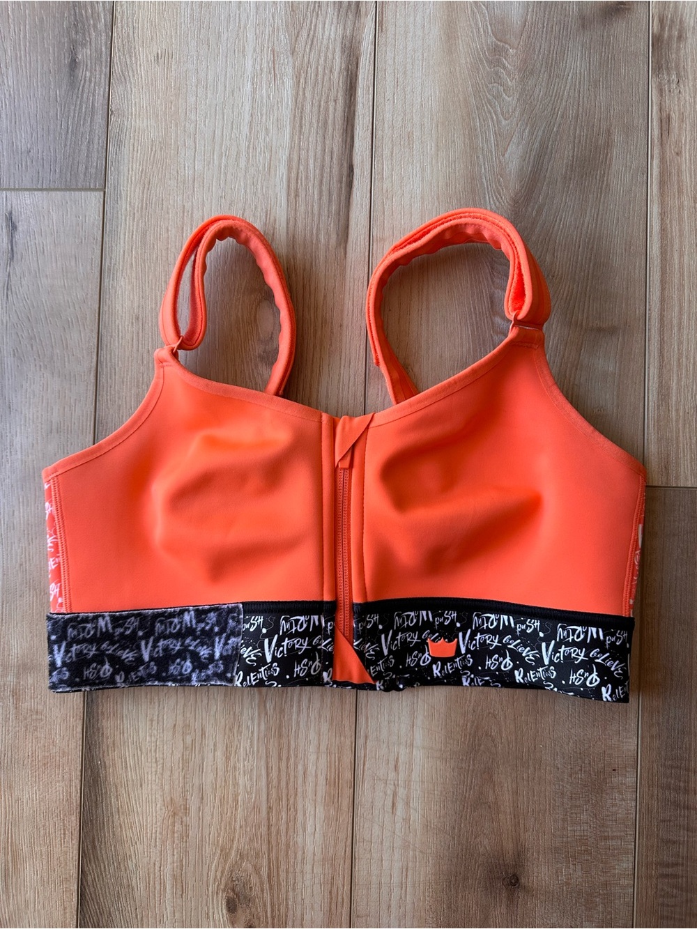 Shefit orange and black lux sports bra